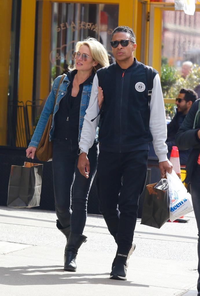 Amy Robach and TJ Holmes walking together