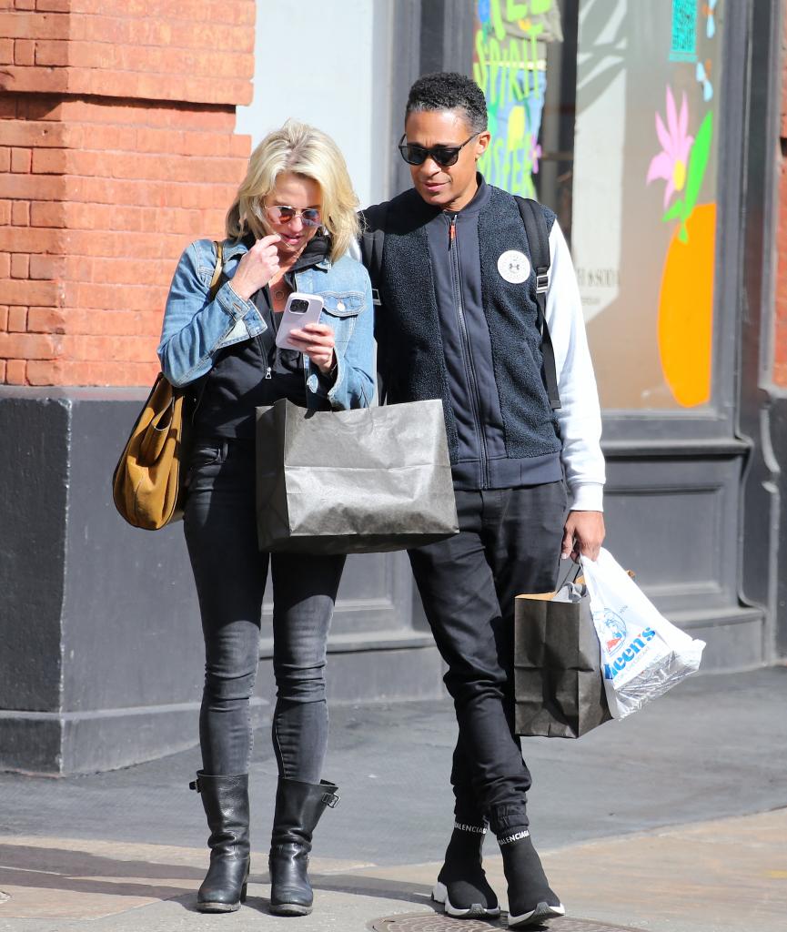 TJ Holmes and Amy Robach walking in New York City together