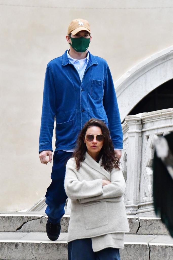 Ashton Kutcher, Mila Kunis walking.