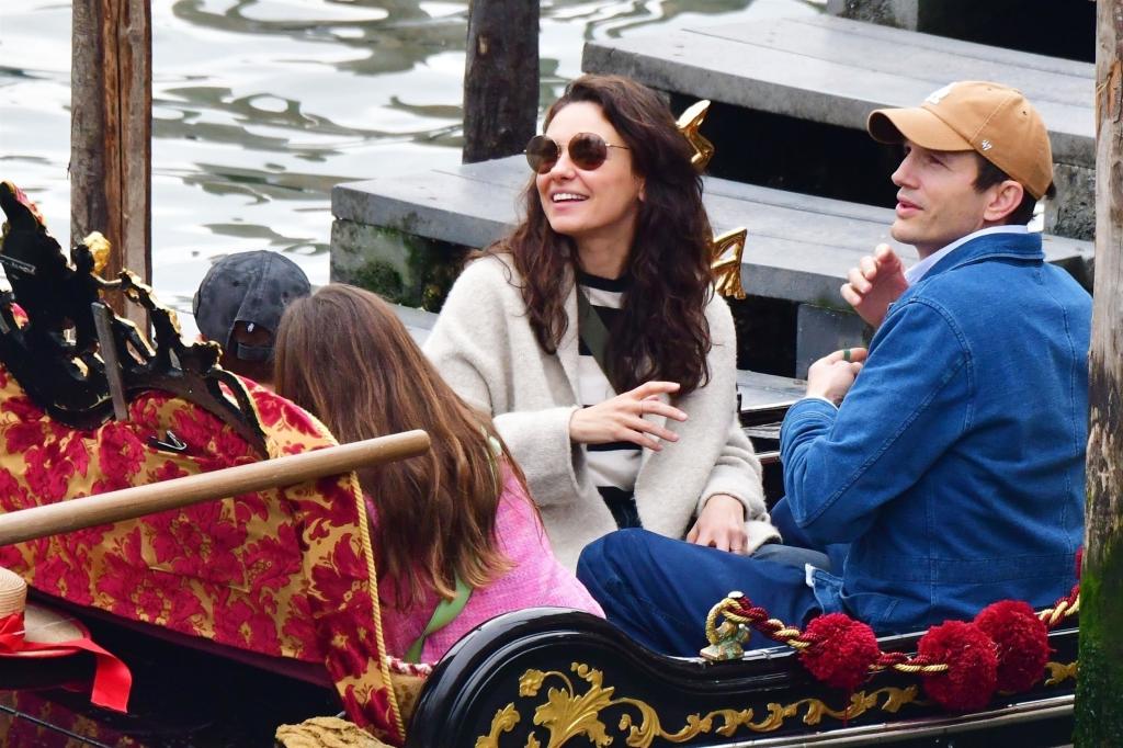 Ashton Kutcher, Mila Kunis with their kids on a gondola.