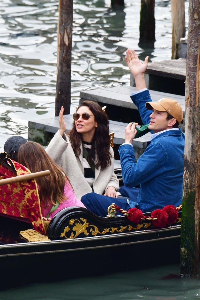 Ashton Kutcher, Mila Kunis with their kids on a gondola.