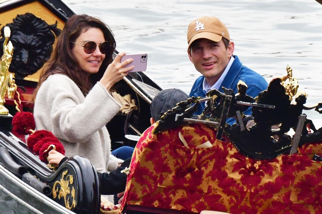 Ashton Kutcher, Mila Kunis with their kids on a gondola.