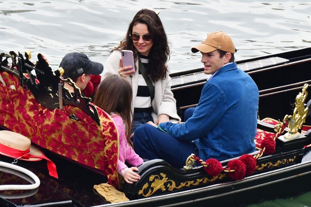 Ashton Kutcher, Mila Kunis with their kids on a gondola.