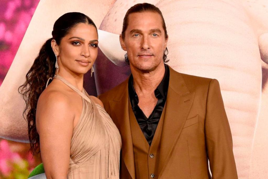 Matthew McConaughey and Camila Alves on a red carpet.