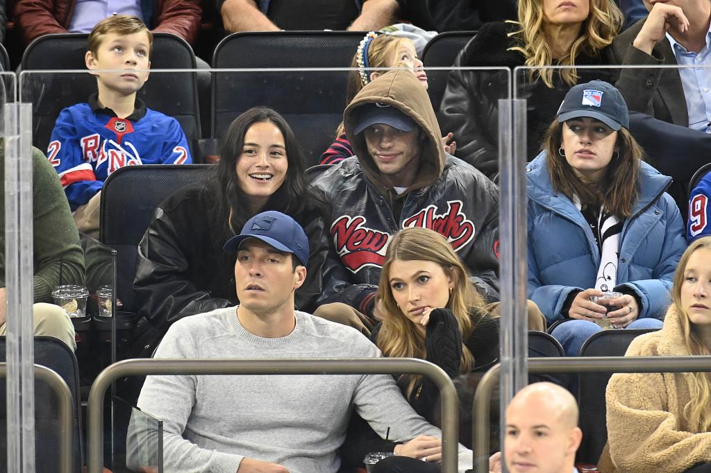 Chase Sui Wonders and Pete Davidson sitting together at a Rangers game.