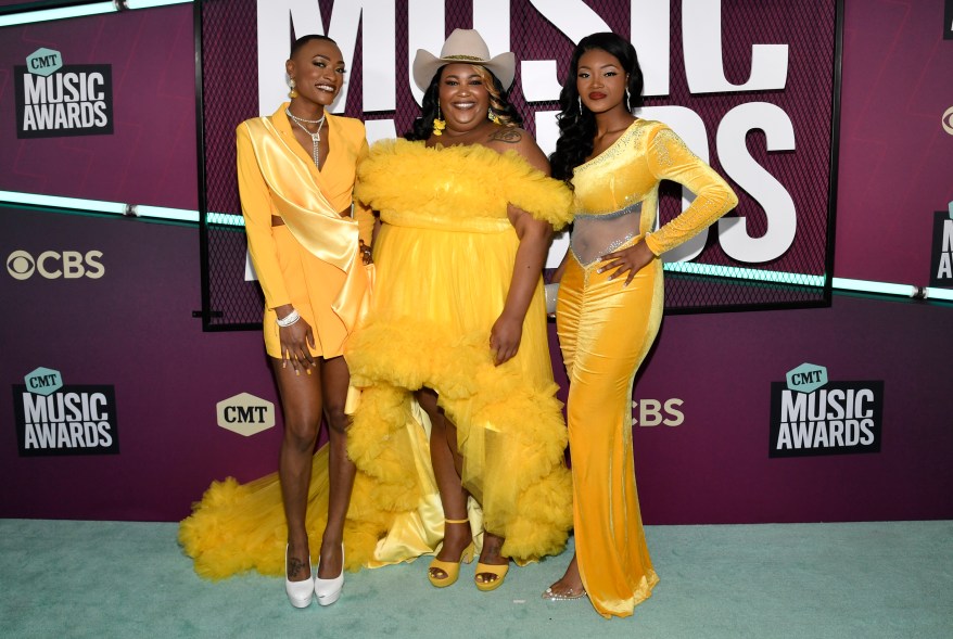 Trea Swindle, Danica Hart, and Devyn Hart attend the CMT Music Awards on Sunday, April 2, 2023, at the Moody Center in Austin, Texas.