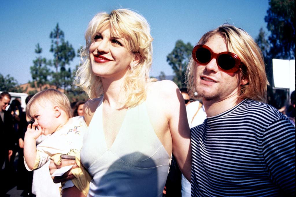 Kurt Cobain, Courtney Love and baby Frances Bean smiling