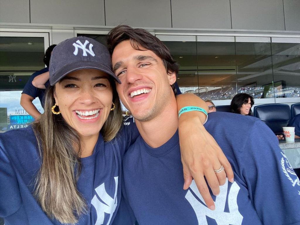 Gina Rodriguez and Joe LoCicero smile at baseball game