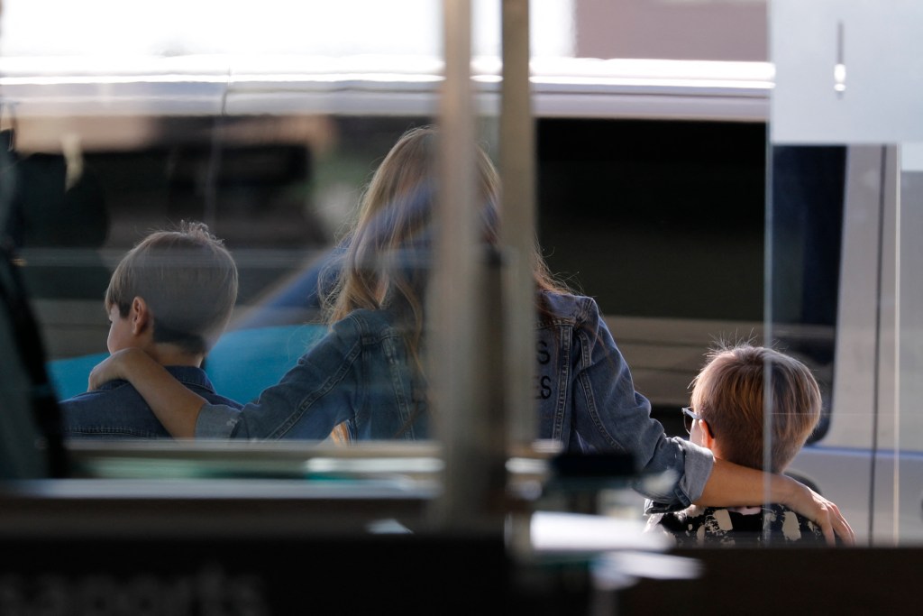 Shakira with her kids at the Barcelona airport.