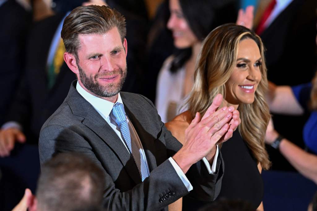 eric and lara trump clapping