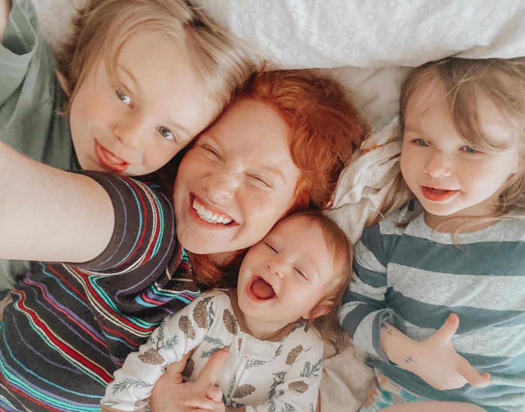 sara beth liebe selfie in bed with her three kids