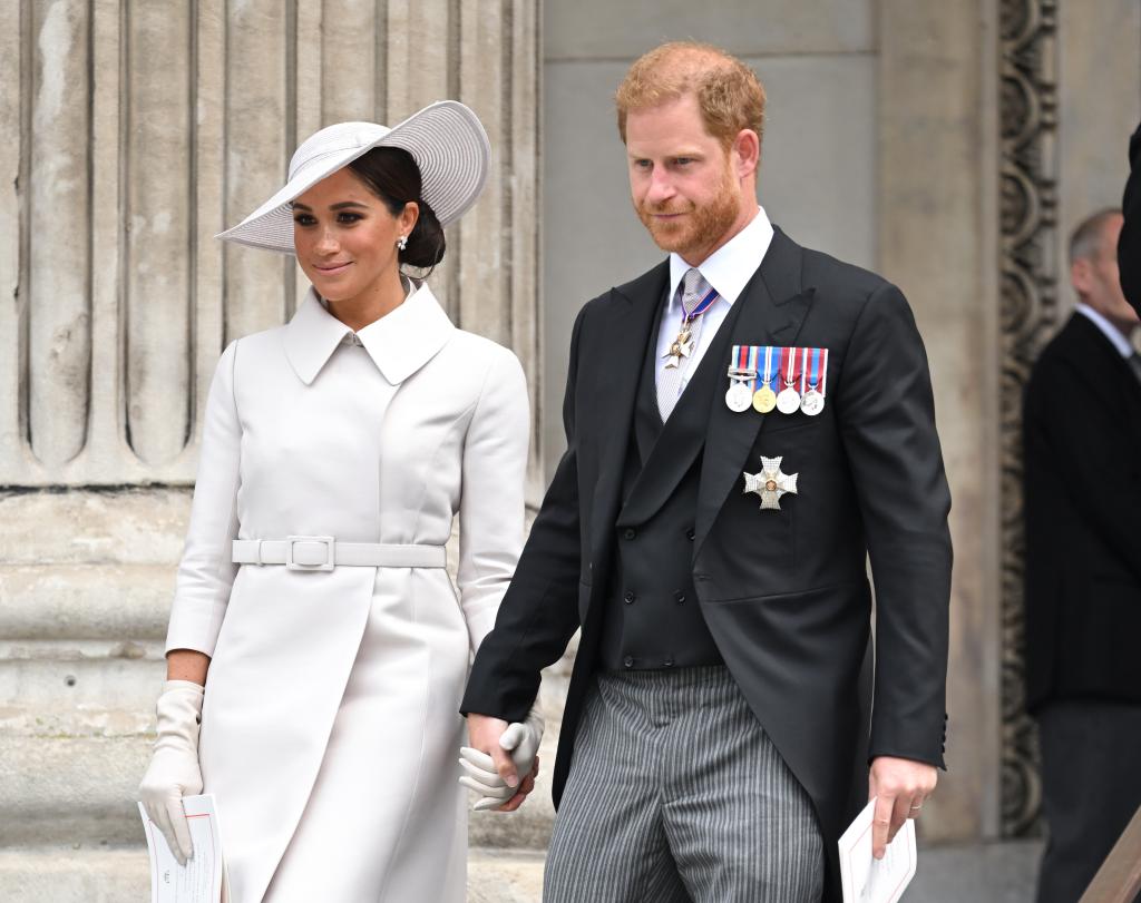 Prince Harry and Meghan Markle walking down stairs together in June 2022.