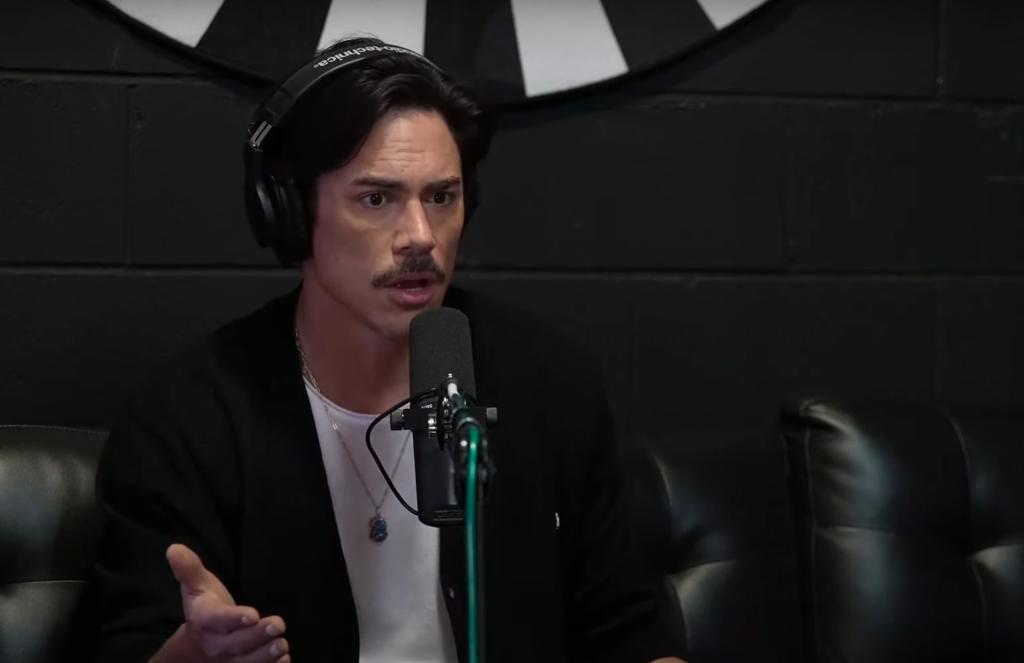 tom sandoval talking into a microphone