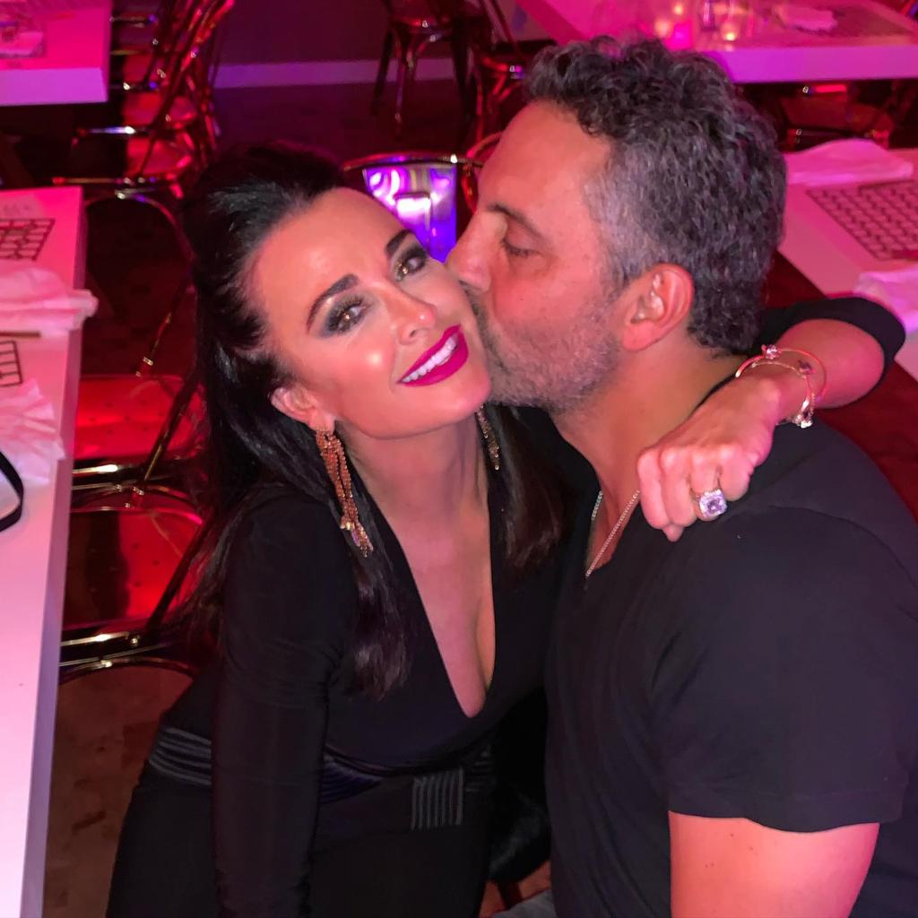 Mauricio Umansky kissing Kyle Richards