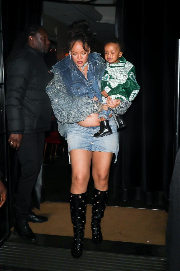 Rihanna holding her son