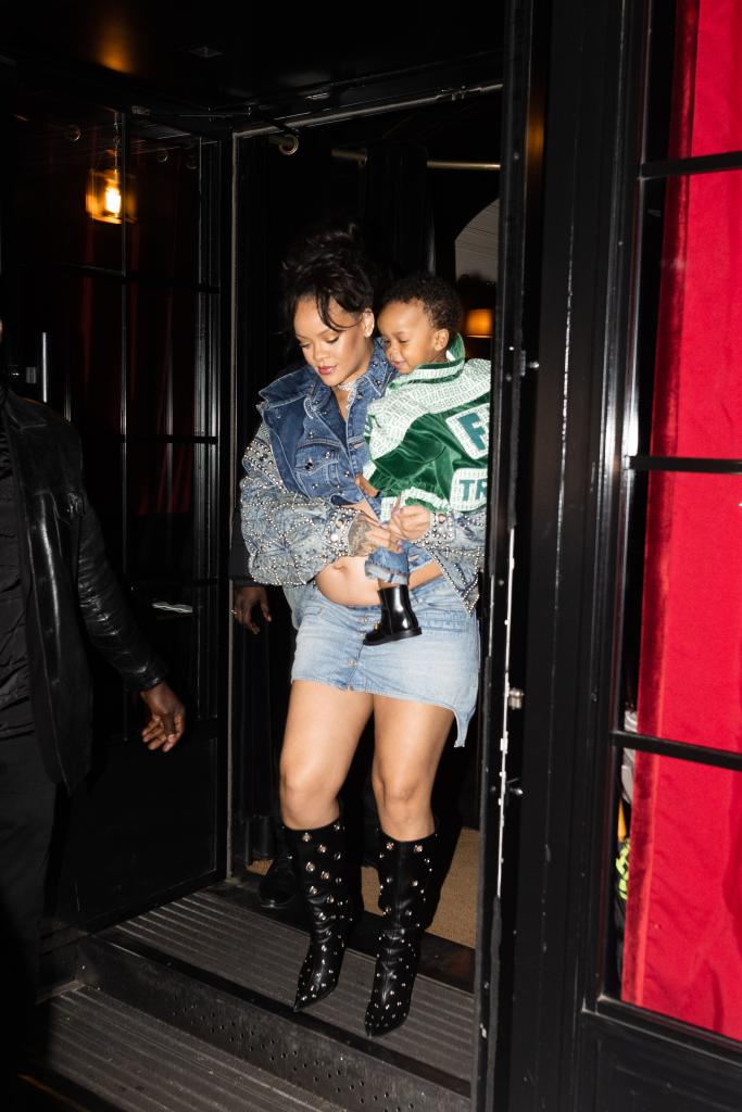 Rihanna carrying her son