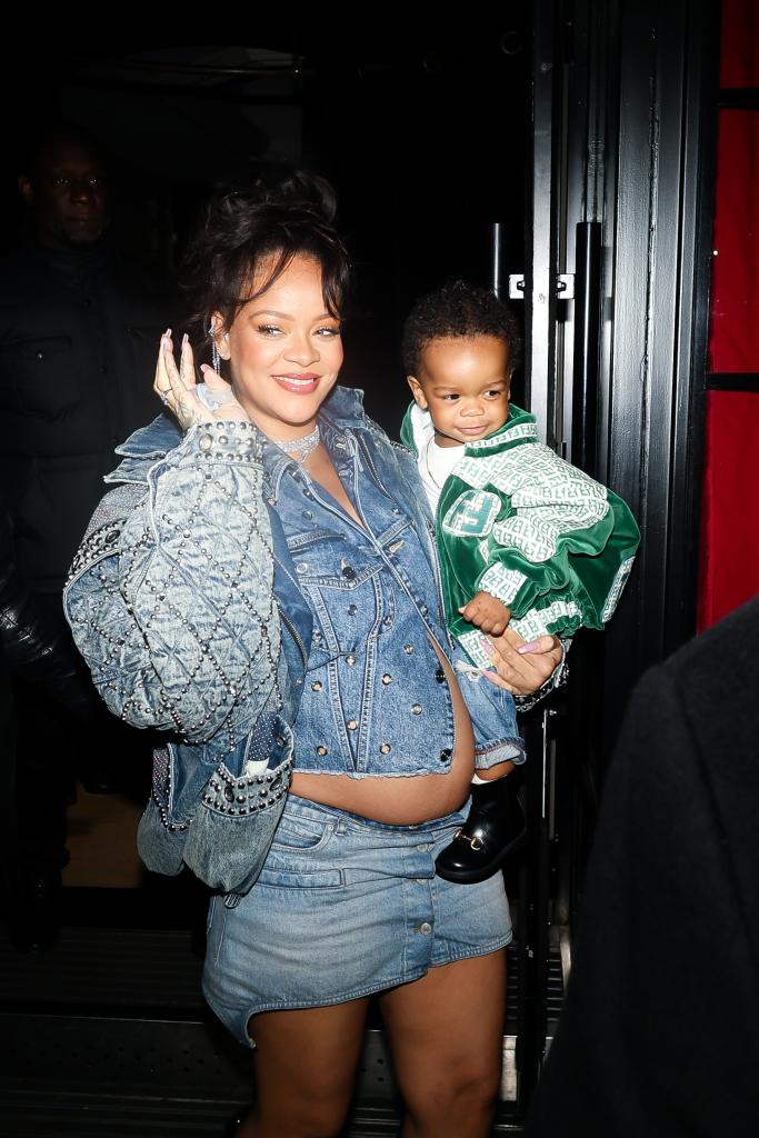 Rihanna holding her son