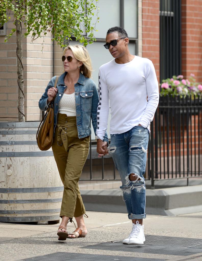 amy robach and t.j. holmes holding hands