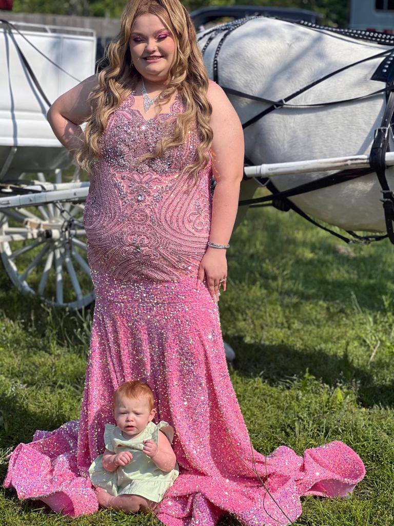 Alana Thompson posing in a prom dress