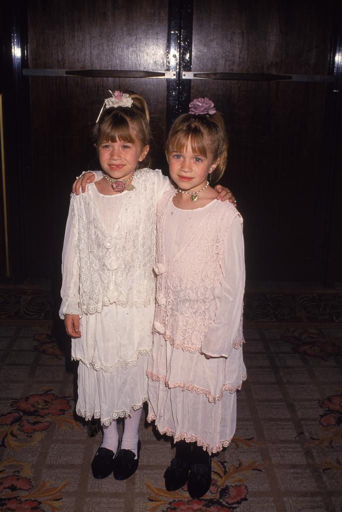 A throwback photo of Mary-Kate and Ashley Olsen at an event.