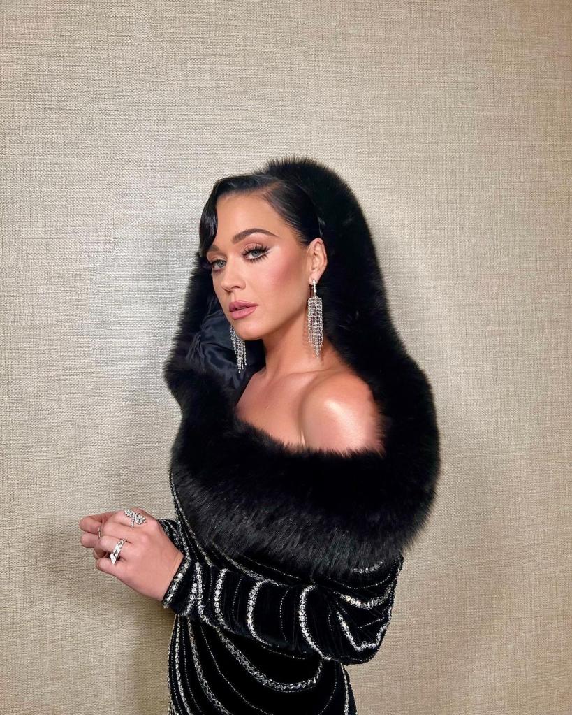 Katy Perry poses in dress and fur hood