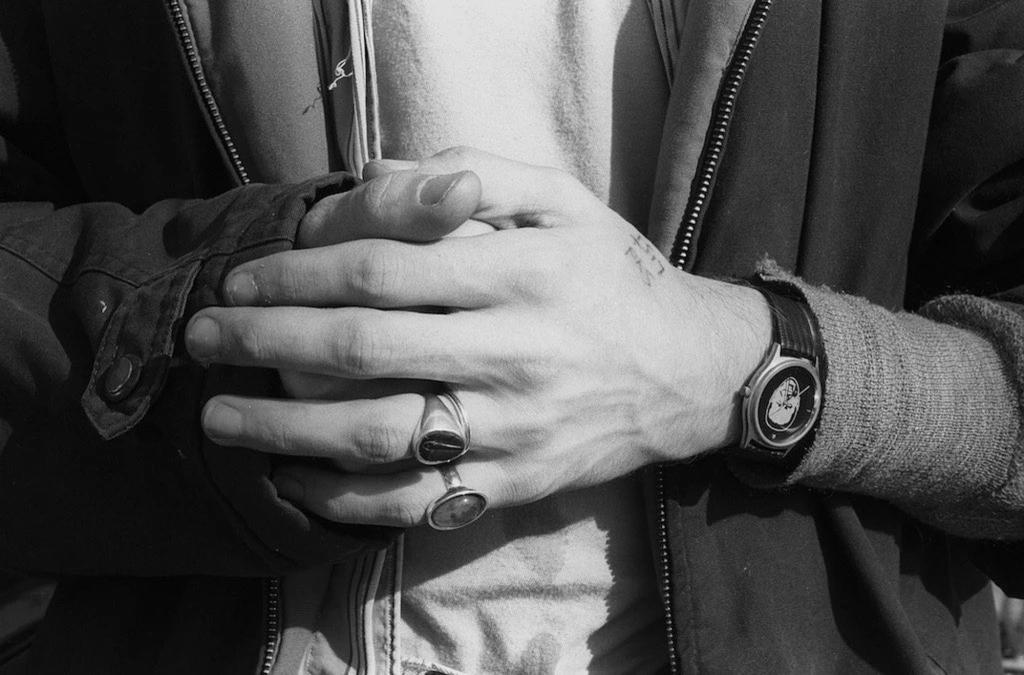 close-up of Kurt Cobain's hands in B&W photo