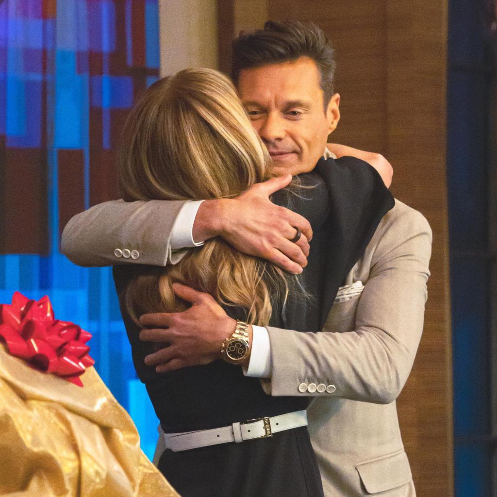 Kelly Ripa and Ryan Seacrest hug