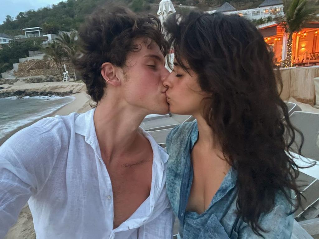 A selfie of Shawn Mendes and Camila Cabello kissing.