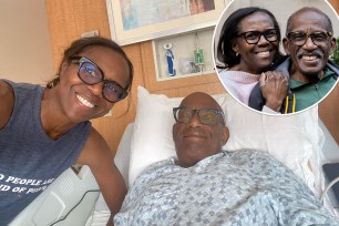 Deborah Roberts and her husband Al Roker in the hospital bed smiling.