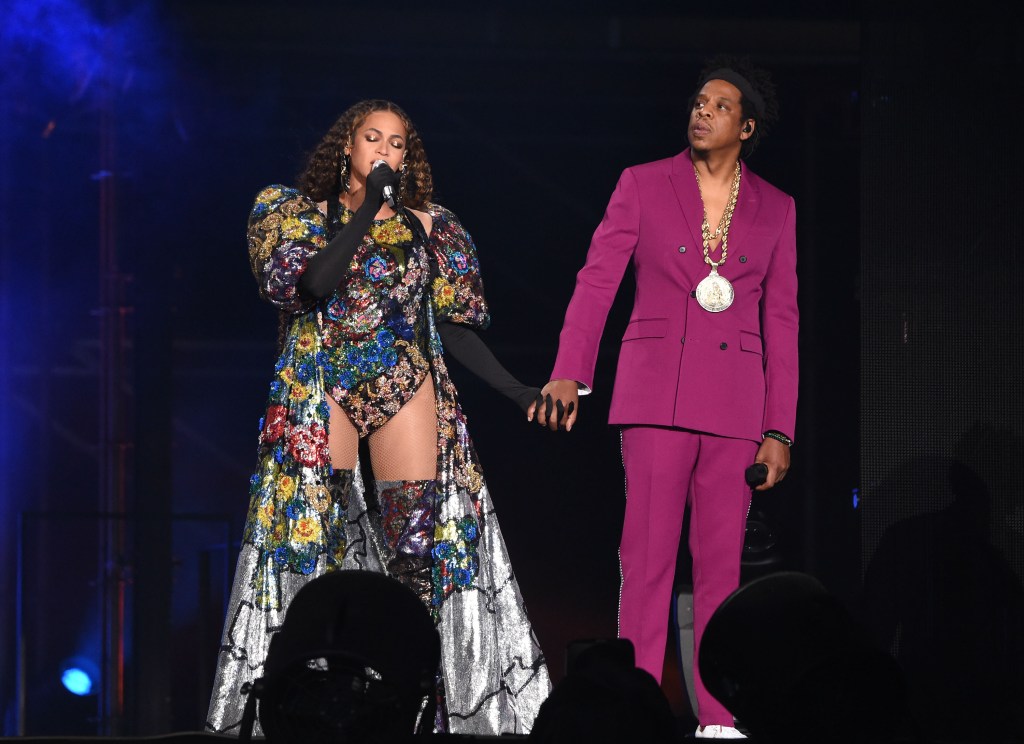 Beyoncé and Jay-Z holding hands while performing together in South Africa.