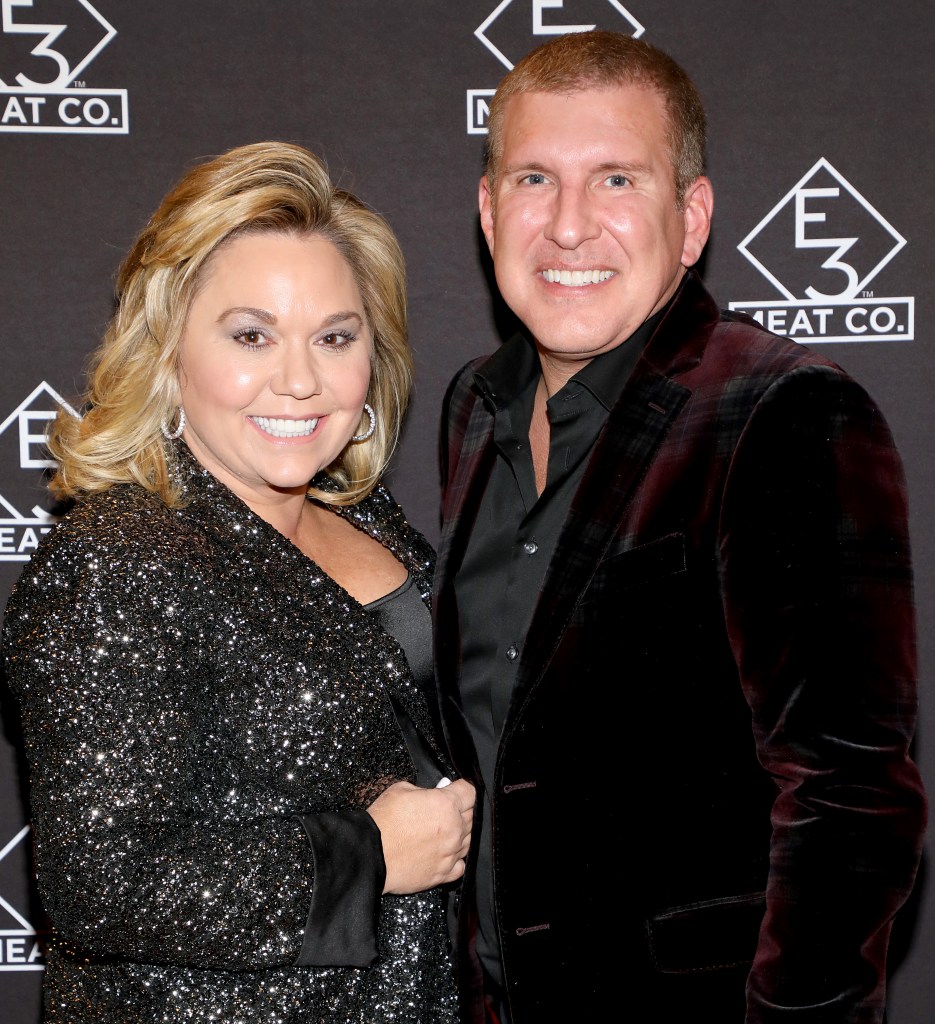 Julie Chrisley and Todd Chrisley on a red carpet.