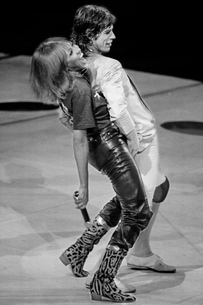 Tina Turner and Mick Jagger performing on stage in 1981