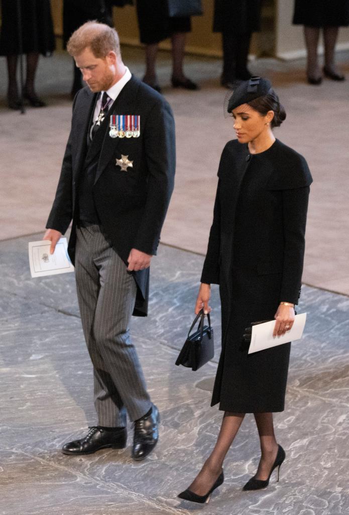 Prince Harry and Meghan Markle standing together.