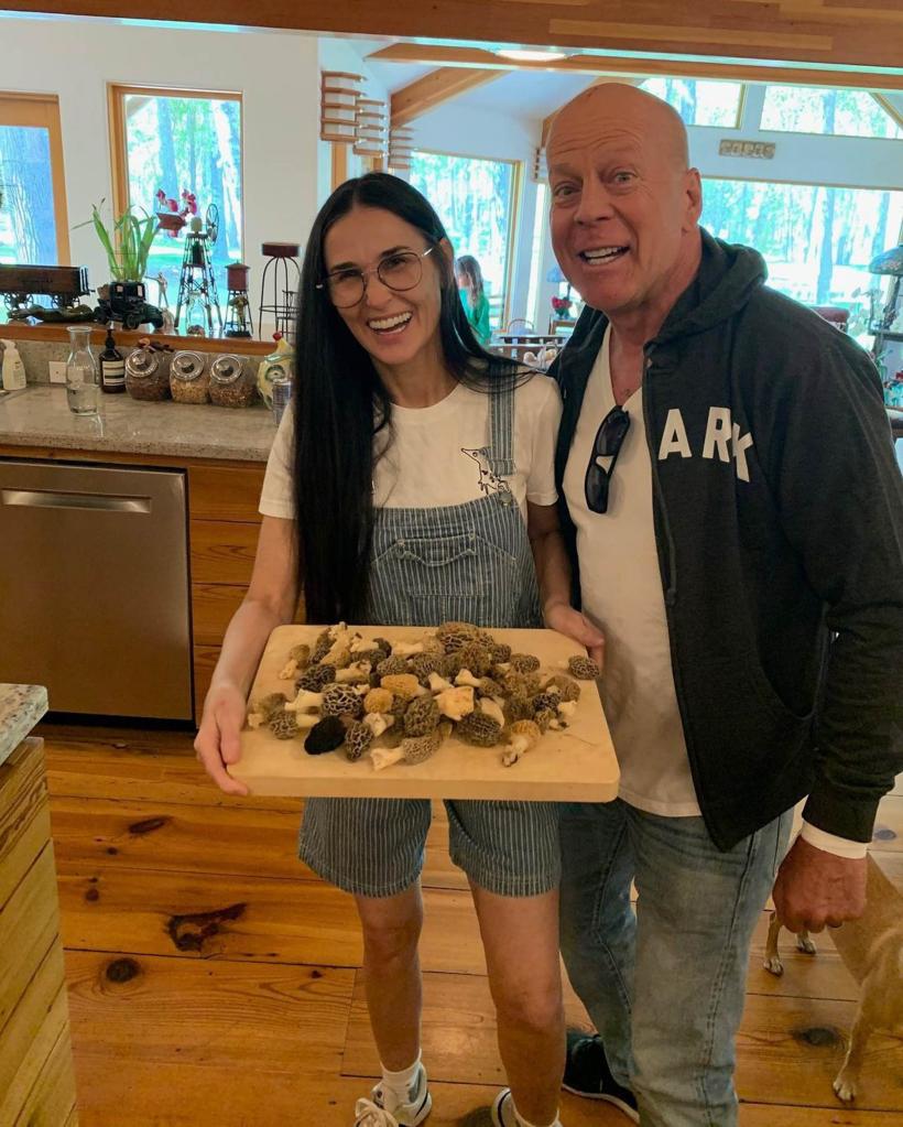 Demi Moore poses in kitchen with Bruce Willis