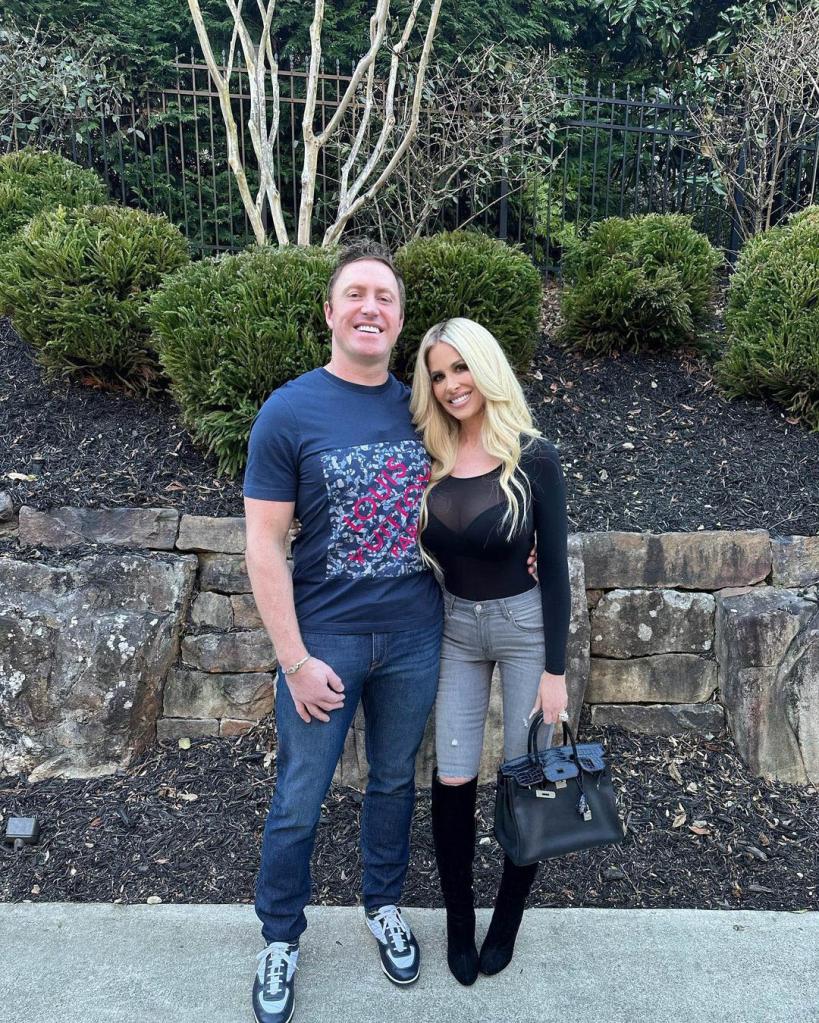 Kim Zolciak stands with Kroy Biermann