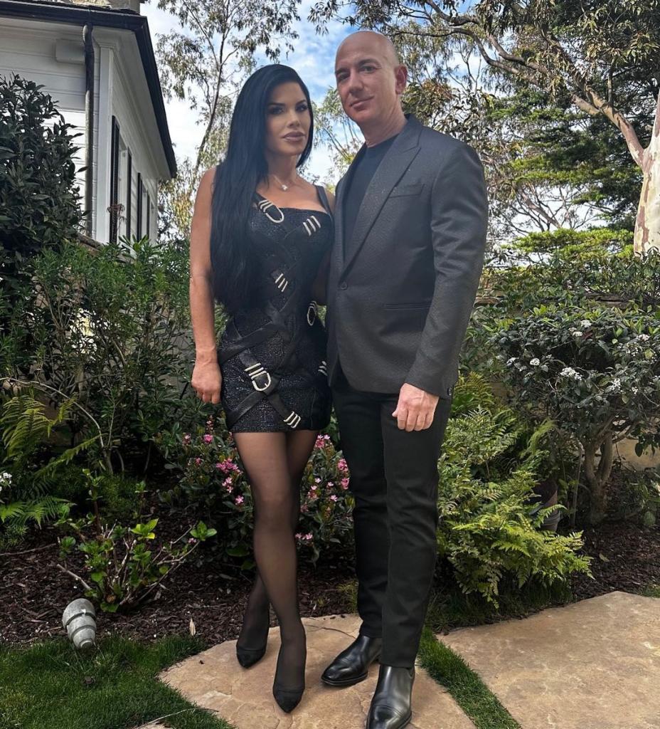 Jeff Bezos and Lauren Sánchez posing for a photo together at an event.