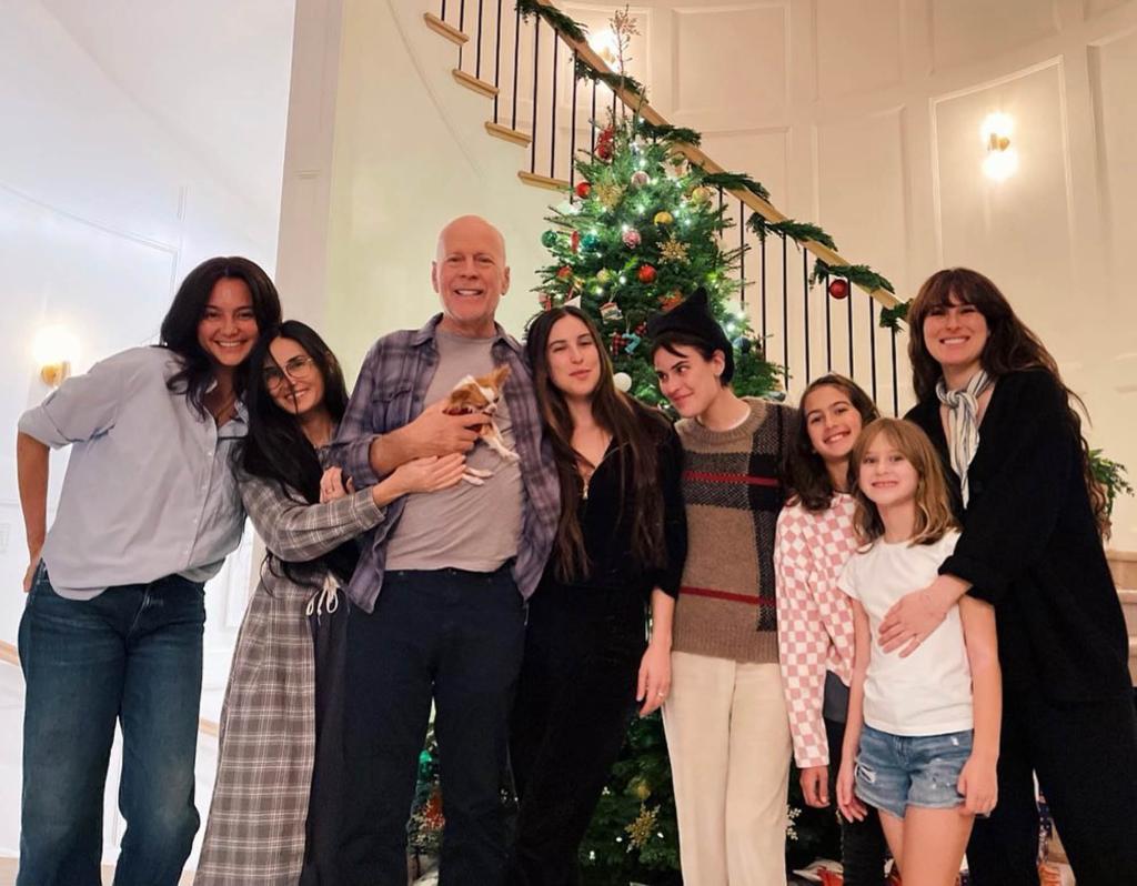 Demi Moore, Bruce Willis, Emma Heming and kids pose in front of Christmas tree