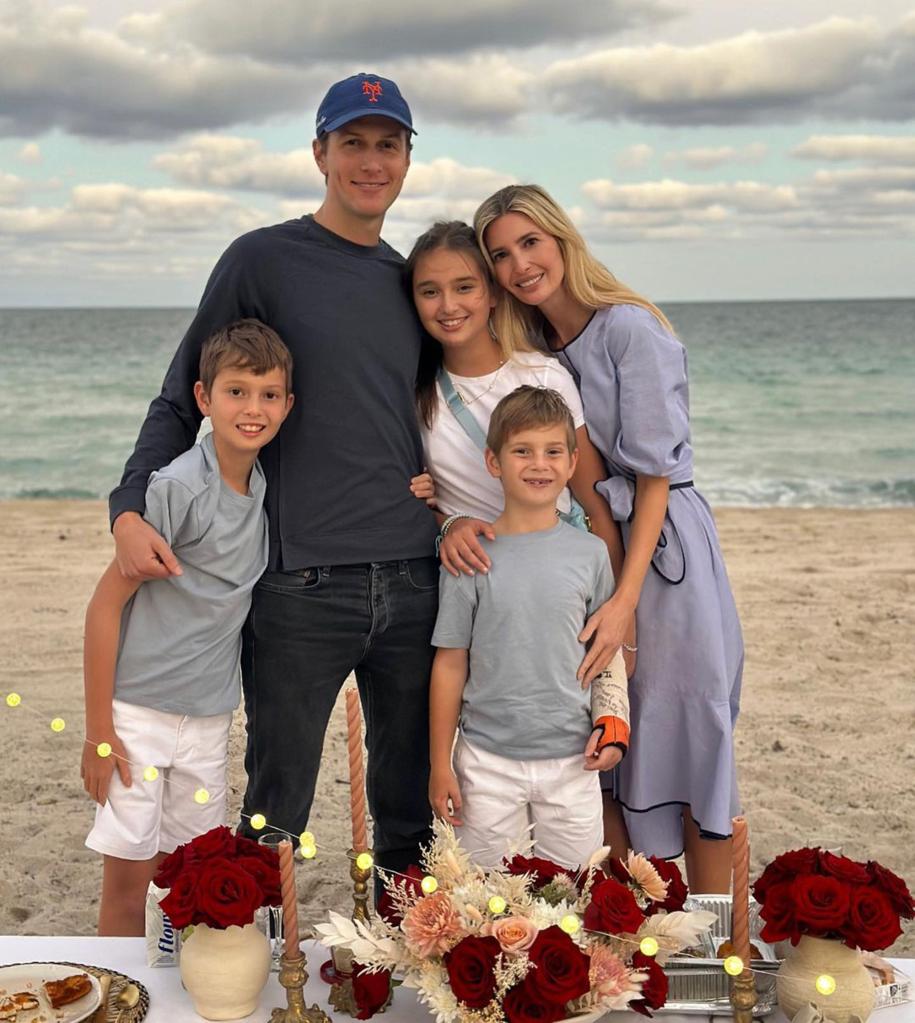 Ivanka Trump and Jared Kushner posing with their three kids at the beach.