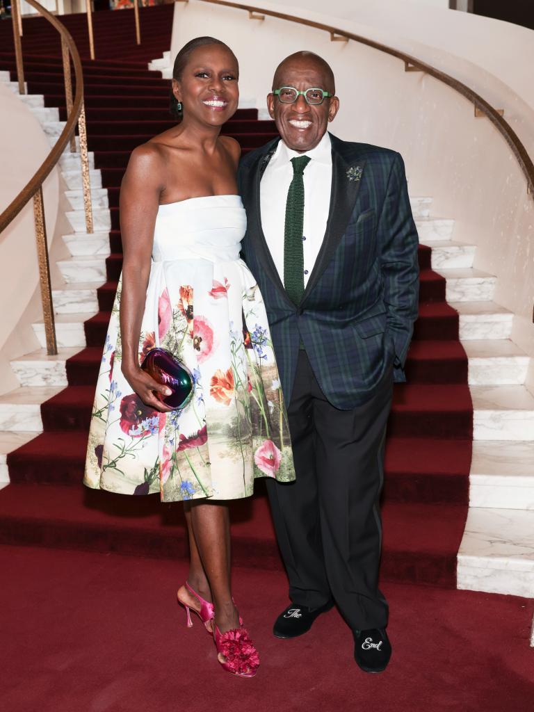 Deborah Roberts and Al Roker posing at a gala.