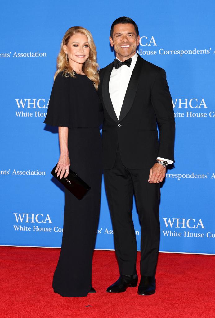 Kelly Ripa and Mark Consuelos on a red carpet.