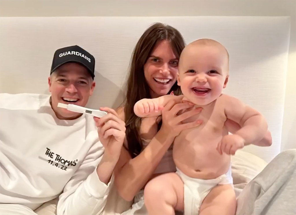 Lareun Scruggs and Jason Kennedy hold son Ryver