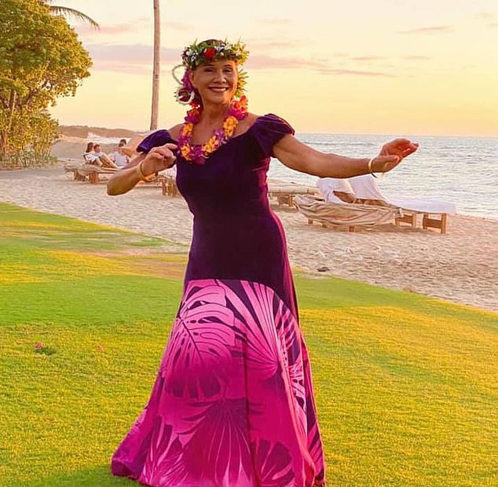 Michelle Amaral dancing hula outside.