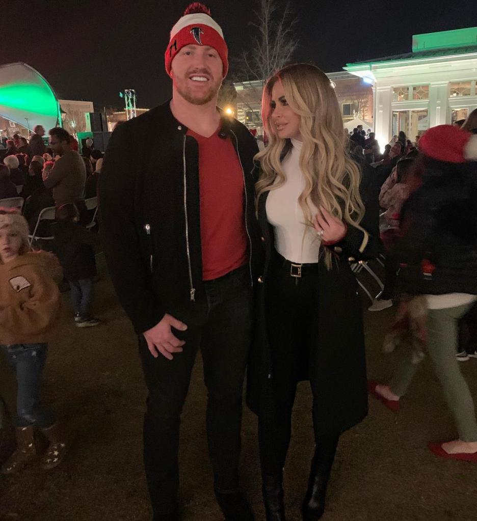 Kim Zolciak and Kroy Biermann posing together.