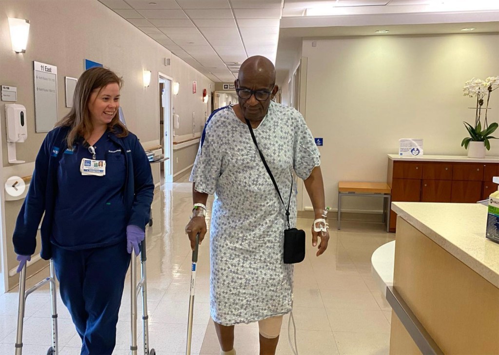 Al Roker walking in hospital with a nurse.