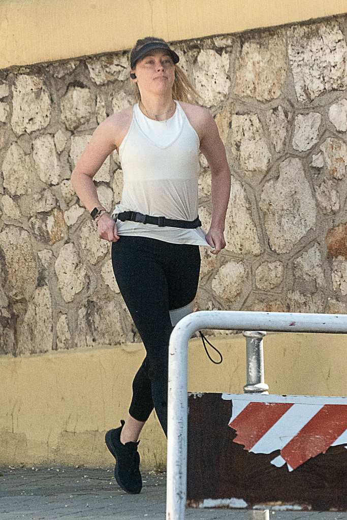 Amber Heard goes for a run in Spain.