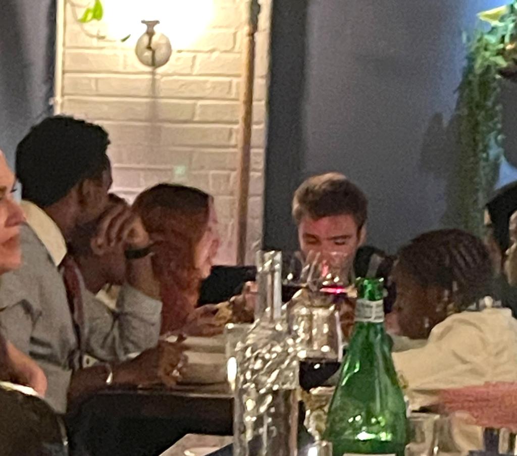 madonna sitting with her six kids around a restaurant table