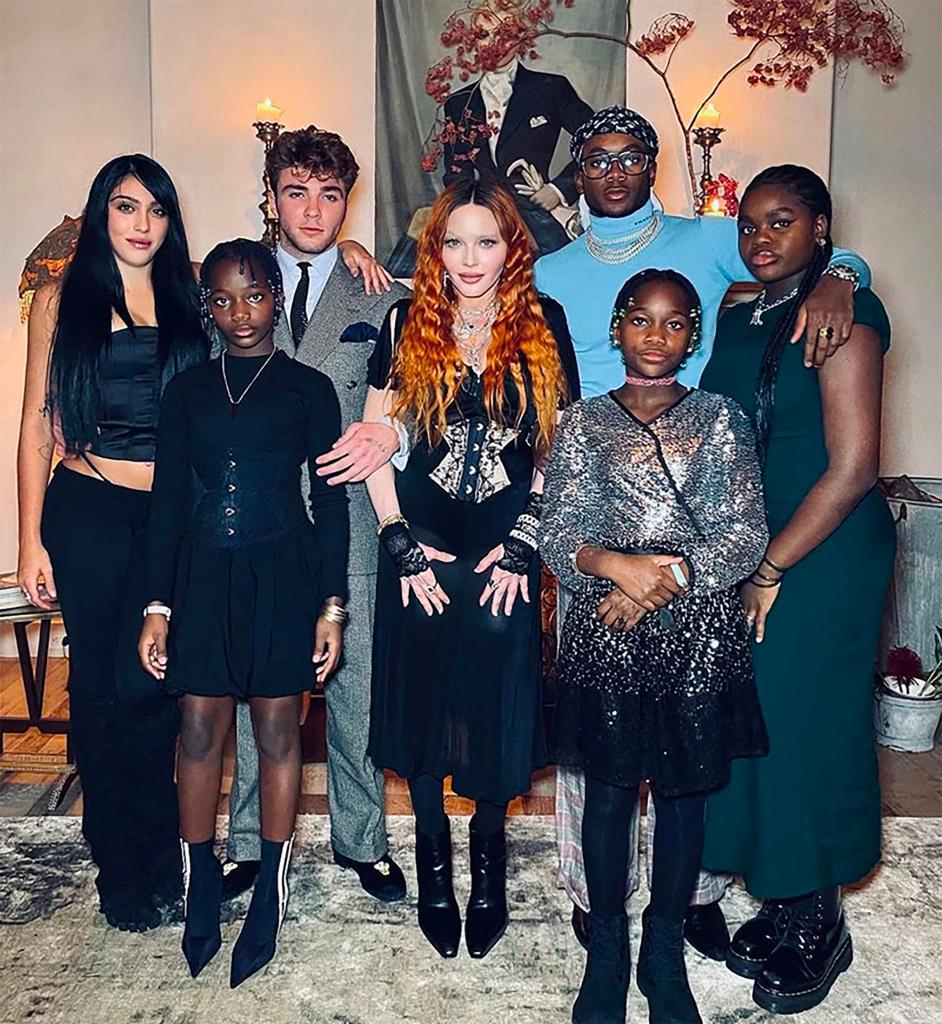 madonna posing with her six children