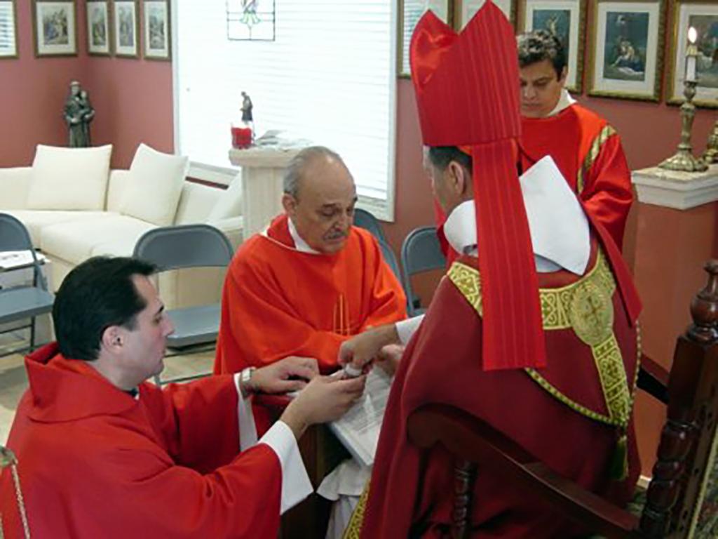 Ken Rosato working as a priest.