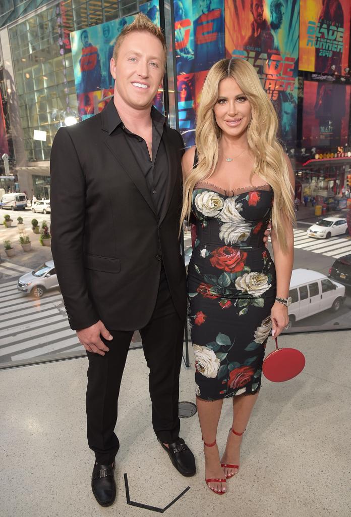 Kim Zolciak and Kroy Biermann posing together.