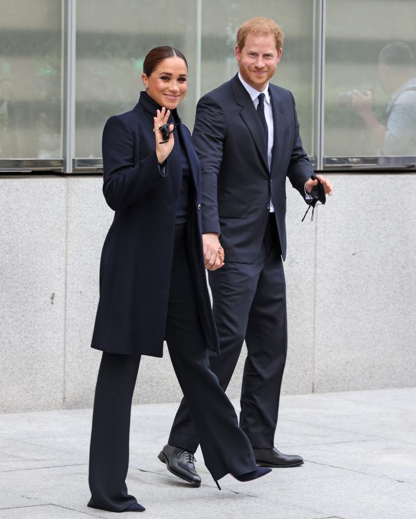 Meghan Markle and Prince Harry holding hands.